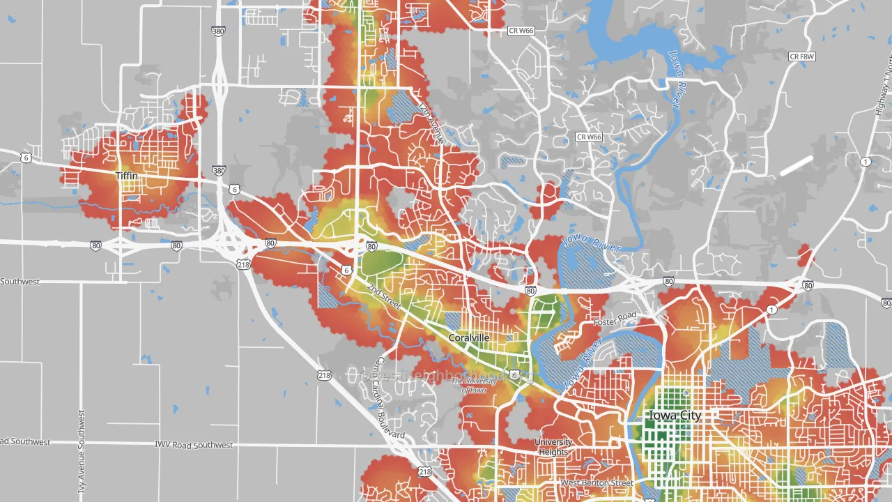 Walk Grade map of Coralville, IA, walkable areas in green and car-dependent areas in red