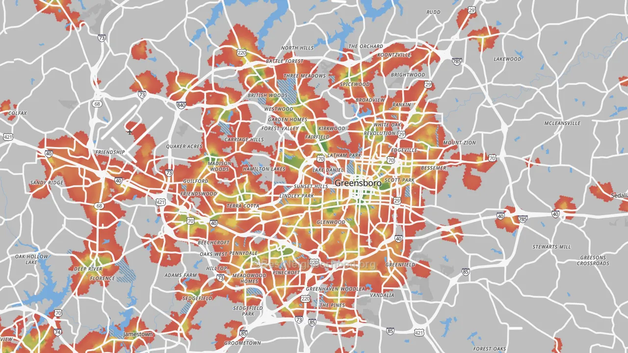 Walk Grade map of Greensboro, NC, walkable areas in green and car-dependent areas in red