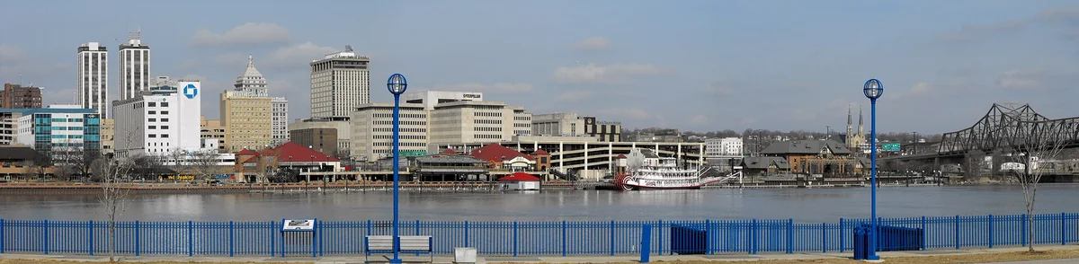This is a photograph shot in panoramic format from the East Peoria side of the river of downtown Peoria, Illinois
